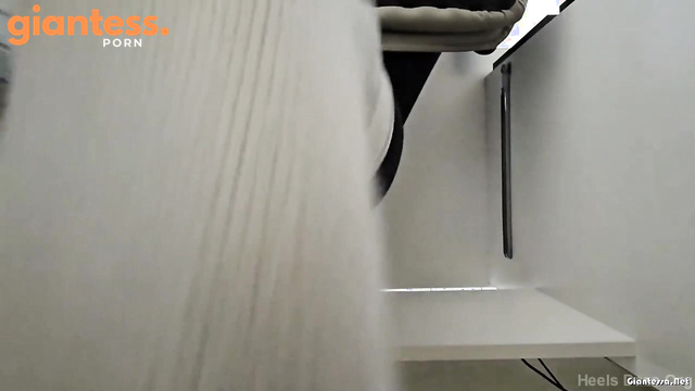 Heels Daze Org - Busy Giantess In Grey Socks: Working On Her Laptop In The Tiny Office